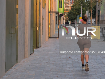Woman Jogging Alone In The City