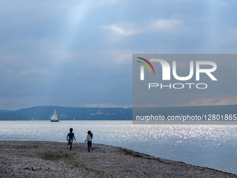 Children At Lake In Autumn
