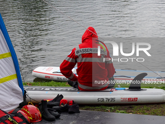 German Water Rescue Paramedic With Rescue Board