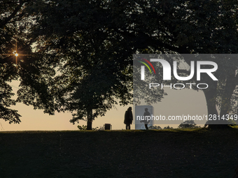 People At Sunset In Park