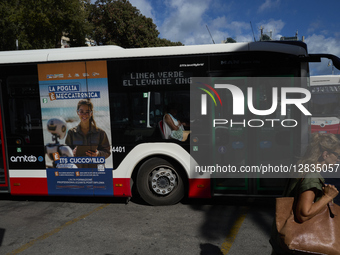 Street Scene With City Bus And Woman Walking In Bari, Italy