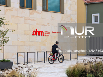 Boy Cycling With Shopping Plastic Bag