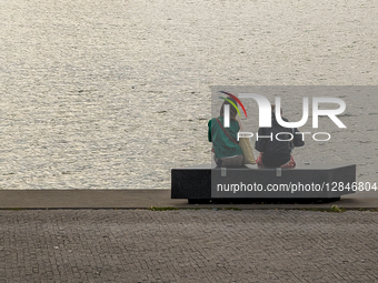 Two Women By The River