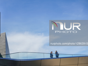 Women Talking On Bridge