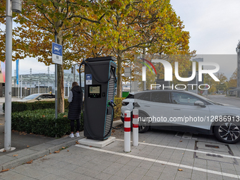 Electric Car Charging At Public Station