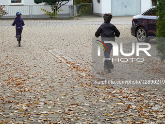 Children Riding Scooters With Helmets