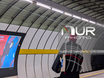 Woman With Headscarf Waiting At Metro Station