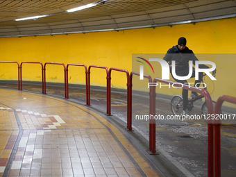 Cyclist Rides Through Underpass While Using Mobile Phone In Venice