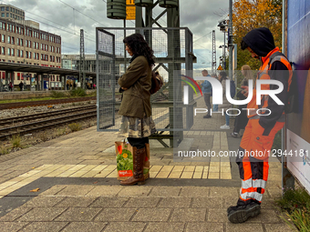 Rail Worker Use Smartphones While Waiting For S-Bahn
