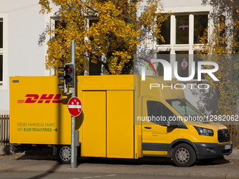 DHL Electric Delivery Van In A Residential Area