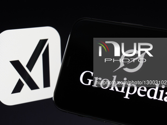 Grokipedia Logo Displayed On Smartphone Over Computer Keyboard