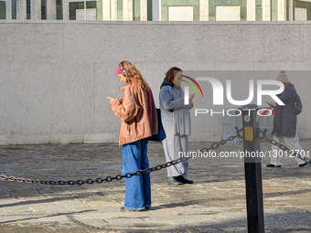 Three Women Focused On Smartphones On Square