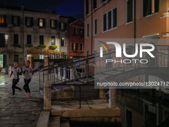 Women Jogging Together In Venice At Night