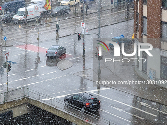 Snow Rain Falling On Wet Traffic Intersection In Munich