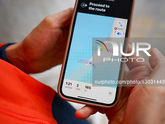 Traveler Navigating Streets With Smartphone