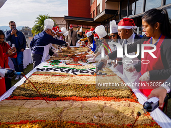 People Are Participating In A Christmas Cake-mixing Ceremony In Kathmandu, Nepal