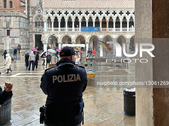 Police Officer Patrolling Piazza San Marco In Venice