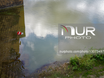 Submerged Traffic Sign At The Arno River Bank In Florence