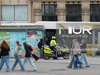 Belgian Police Officer On A Motorcycle Patrol In Ghent City Center