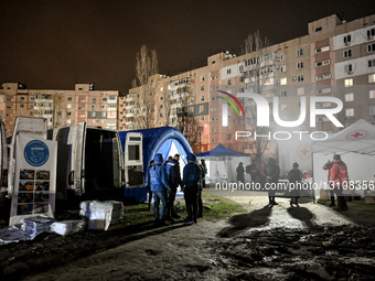 First responders work at Zaporizhzhia apartment block hit by Russian guided bomb.