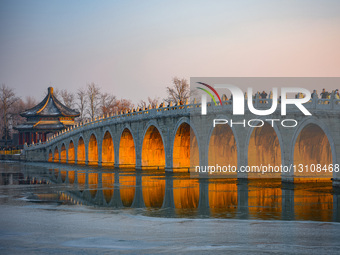 Sunlight Passing Through The Arch of the Seventeen-Arch Bridge in Summer Palace.