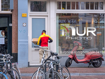 DHL Parcel Delivery By A Canal In South Holland