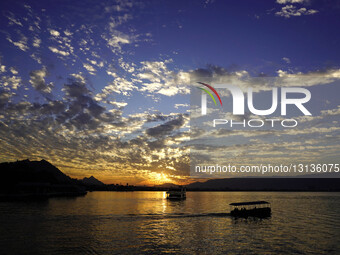 Tourists Enjoy A Boat Ride During Sunset At The Ana Sagar Lake In Ajmer, India