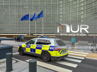 Belgian Police Vehicle And European Union Flags At Berlaymont Building In Brussels
