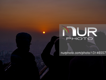 People Embrace The First Ray Of Sunshine In The New Year 2026