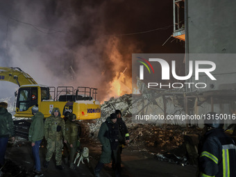 Mitigating consequences of Russian missile strike on residential building in Kharkiv.