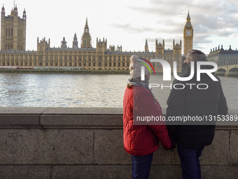 Couple View The Palace Of Westminster And Elizabeth Tower In London
