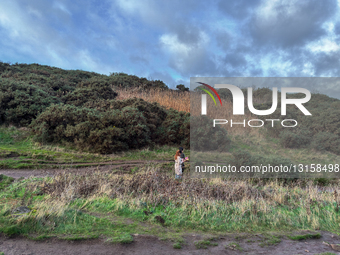 Couple Carrying Food Boxes While Hillwalking Near Arthur’s Seat In Holyrood Park
