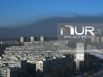 Smoke blankets Kyiv due to large-scale fire.