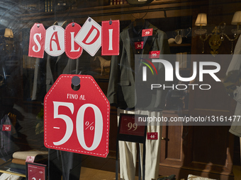 Winter Sale Signage Displayed In Clothing Store Window