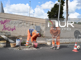 Road Workers Resurface Street In Central Bari