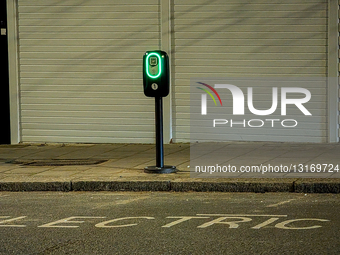 Electric Vehicle Charging Stations Along A Residential Street In London