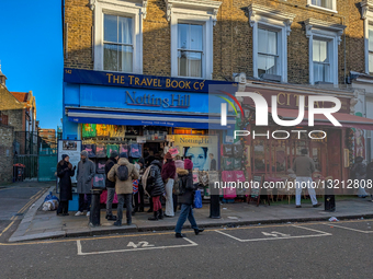 Tourists Outside The Travel Book Co. In Notting Hill In London