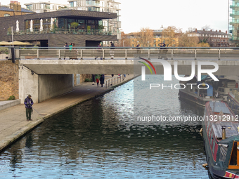 Solitary Angler Fishes At Granary Square On Regent's Canal In London