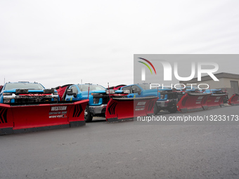 Winter storm response vehicles are parked at a hotel in Tulsa, Oklahoma ahead of a forecast winter storm.