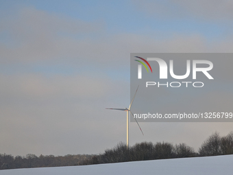 Wind Turbines In A Snow-covered Landscape In Germany