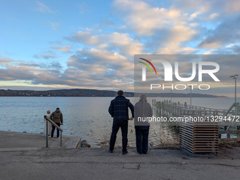 People At Lake In The Early Evening