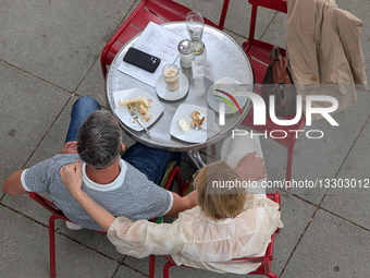 Couple Embracing At Outdoor Cafe
