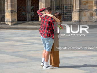 Young Couple Hugging In Public