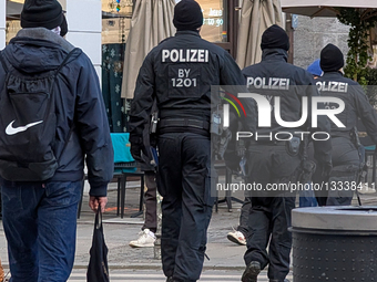 Police Officers Patrolling In Munich