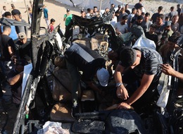 Palestinians Inspect Wrecked Car In Gaza City