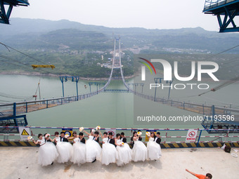 Eight New Couples Celebrate Their Love On China's National Youth Day Over A Suspension Bridge