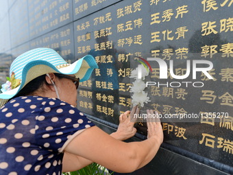 People Commemorate The Victims Of The 1976 Earthquake In Tagshan, China
