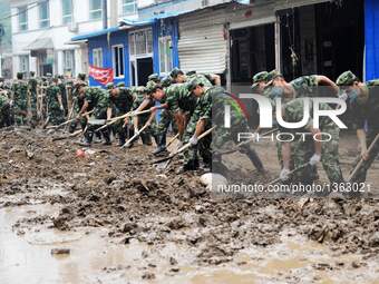 Soldiers Removes Slush From Streets In Jingxing, China