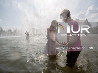 People Cool Down In A Fountain In Moscow