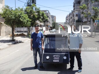 A Solar Car Made By Two Palestinian Students On The Streets Of Gaza